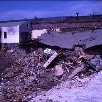 Views of redevelopment sites showing the demolition of buildings in the district. These views date from 1959 to 1964. Specific sites are not identified in this set of images