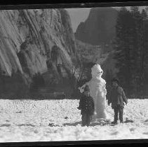 Snowman and two children