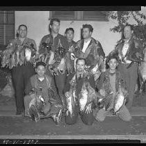 Hunters with dead ducks