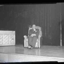 A man sitting on a stage