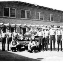 Firemen in front of fire truck