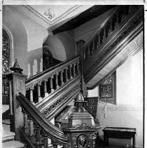 Interior view of the walnut bannisters in St. Francis Catholic Church at 28th and K Streets