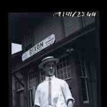 An young man standing at the railroad depot in Dixon