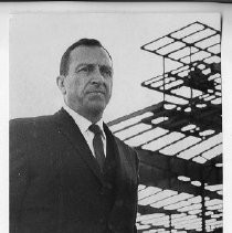 Andrew R. Lolli, Director, California Department of General Services, standing at a racetrack