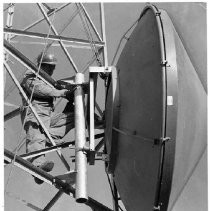 Caption reads: "William Harris, employee of the California Highway Patrol Facilities ad Communications Department, secures an antenna disk to the tower on Mt. Hough, north of Quincy, CA."