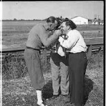 Three men holding a trophy