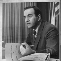 James M. Hall, Secretary of the California Human Relations Agency and also chairman of the State Board of Corrections, holding Keldgord Report on violence in California prisons