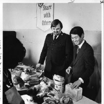 Robert T. (Bob) Matsui gets a tour of the Salvation Army's Toy and Joy Shop from Captain Joe R. Hoogstad