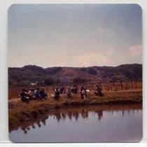 Photographs of landscape of Bolinas Bay. Group of archaeoligists sitting around Bolinas Lagoon, Sept. 1, 1973