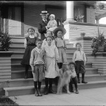 Family portrait on front porch of house
