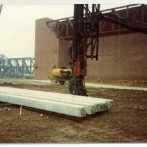 Photographs from Sacramento History Museum Groundbreaking. Concrete piles sitting next to pile driver