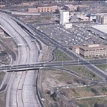 Views of redevelopment sites showing the demolition of buildings and reconstruction in the district. These views date from 1959 to 1970. These views date from 1959 to 1970. This view shows the I-5 freeway under construction looking north