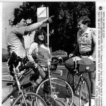 UC Davis bicycle police assist a student