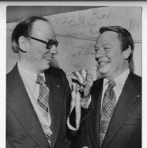 Dr. Byron Demorest, left, incoming president of the Golden Empire Council of Boy Scouts of America, admires Silver Bear Medal presented to Harold S. Hook, right, outgoing president, for outstanding service