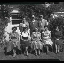 People sitting in a yard