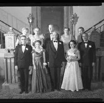 Group of unidentified men and women in formal dress