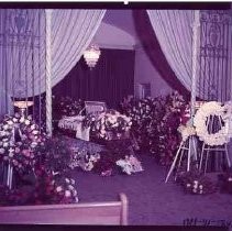 Casket decorated with floral tributes