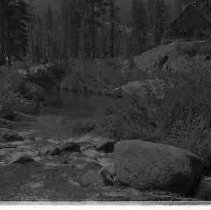 A cabin next to a river