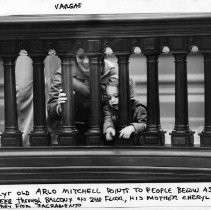 Two year old, Arlo Mitchell points to the people below as he peers through the balcony on the second floor of the California State Capitol building. His mother, Cheryl looks on