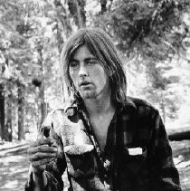 Young Long-haired Man on a Bench