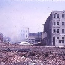 Views of redevelopment sites showing the demolition of buildings in the district. These views date from 1959 to 1964. Specific sites are not identified in this set of images