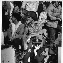 Officer Sits at Pig Bowl