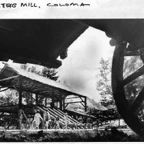 Visitors tour the replica of Sutter's Mill in Coloma