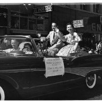 View of Admission Day Parade in Sacramento, Sept. 9, 1958. This view shows the Grand Marshals, Frank Christy and Edna C. Williams from the Native Sons and Daughters of the Golden West Parlors in their car on K Street