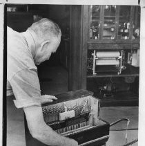 Mel Locher, organ repairman and collector, with his Frei street organ