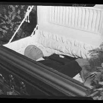 Unknown deceased man in a casket