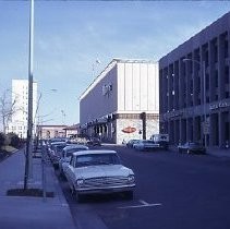 View of Macy's Department Store next to Capital Clothing Company on the right