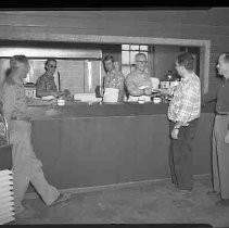 Six men with beverage cups