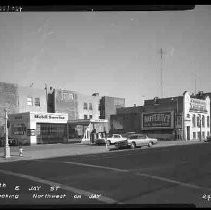View shows Paul Burke's Mobil gas station and other businesses