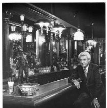 Carl Cope seated at bar of Firehouse restaurant