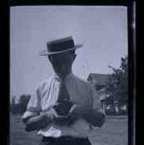 An unidentified men holding a camera