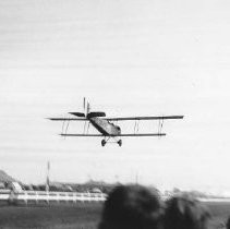 Bi-plane lands at a fair