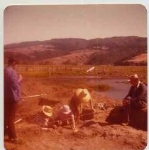Photographs of Bolinas Bay. Archaeological dig site, with unidentified archaeologists working in trench