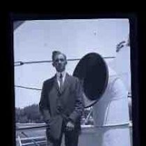 A young man standing on ship