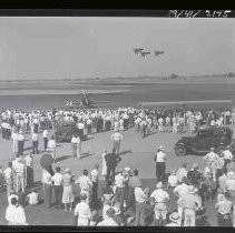 Three single engine airplanes flying in formation