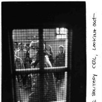 "Inside solitary cell, looking out"