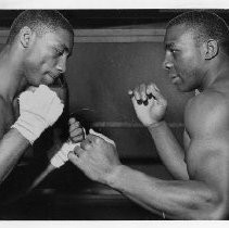Fred "Preacher" Lewis, the boxer (on right); sparring partner identified only as "Leslie"