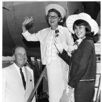 Elaine Drake Camellia Queen and her mother Mrs. F. Robert Drake as they board the plane for Seattle. Seeing them off is G. Wayne O'Brien, president of the Camellia Festival