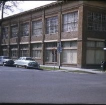 Views of redevelopment sites, renderings, and table models for the proposed Redevelopment District. Includes maps and site plans