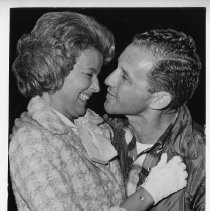 Dr. Alvin Marks, pilot and owner of Skymark Airlines, embraces his wife Phoebe after his attempted solo around-the-world flight