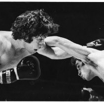 Joe Guevara (right) and Frankie Duarte exchange punches at close range during their state title bout