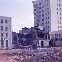 Views of redevelopment sites showing the demolition of buildings in the district. These views date from 1959 to 1964. Specific sites are not identified in this set of images