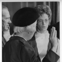 Karen A. Holden, right, is sworn in as the first woman officer in the California National Guard by Gen. Mildred Bailey as Guard cmdr. Gen. Glenn C. Ames looks on