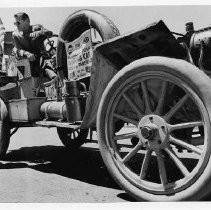 Pert Patti Smith, Miss Sacramento, has her first look at the famous Thomas Flyer, winner of the New York to Paris car race in 1908