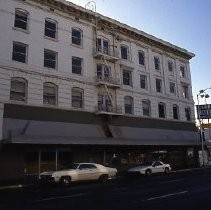 Views of redevelopment sites showing hotels, theaters, restaurants and other businesses. This view is the Clunie Hotel at 805 K Street