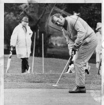 Bob Lunn, pro golfer, putts the ball on the 12th green at Pebble Beach